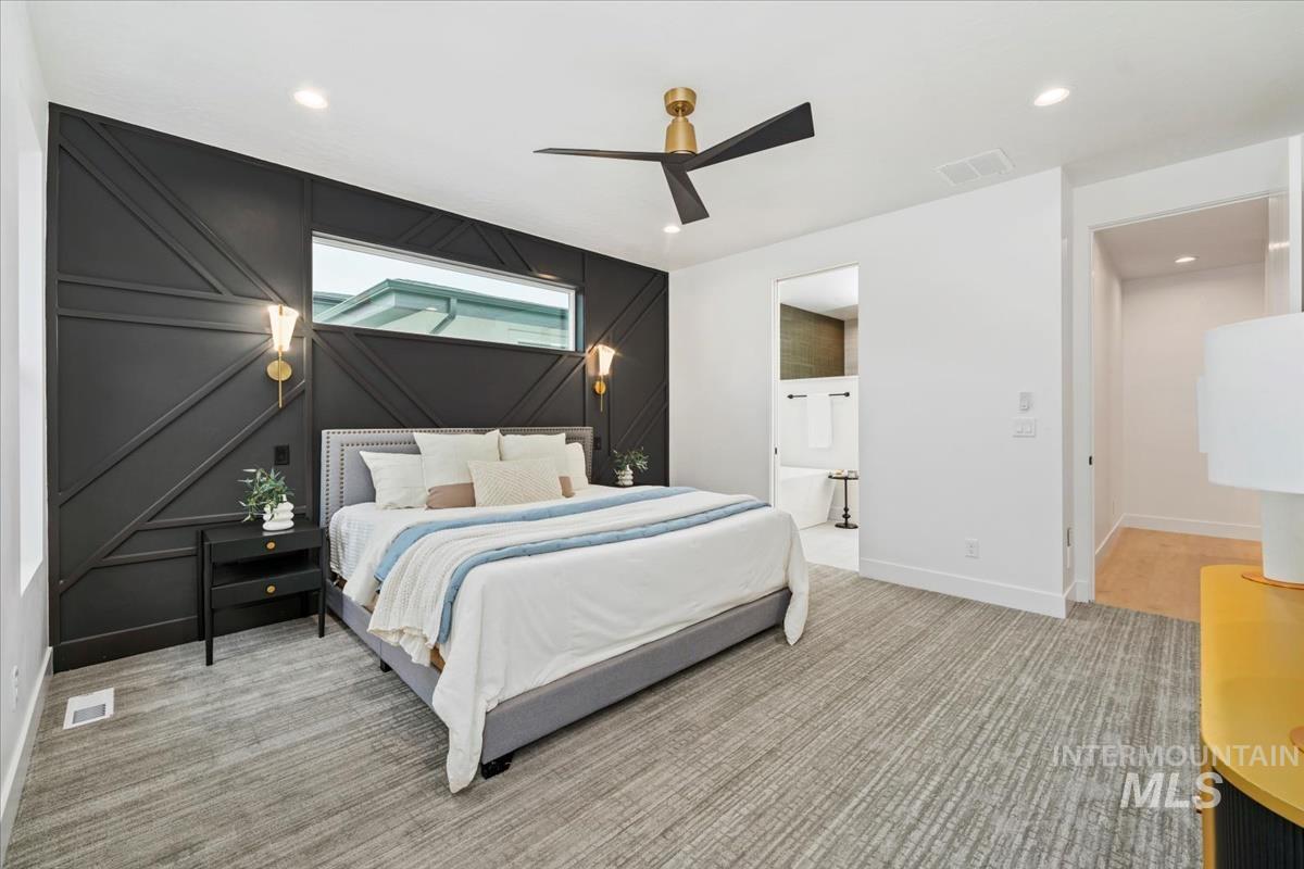 6248 West Elmer Street Boise, ID 83703 - Photo 16 of 40 Bedroom featuring an accent wall, a ceiling fan, light carpet, recessed lighting, and connected bathroom