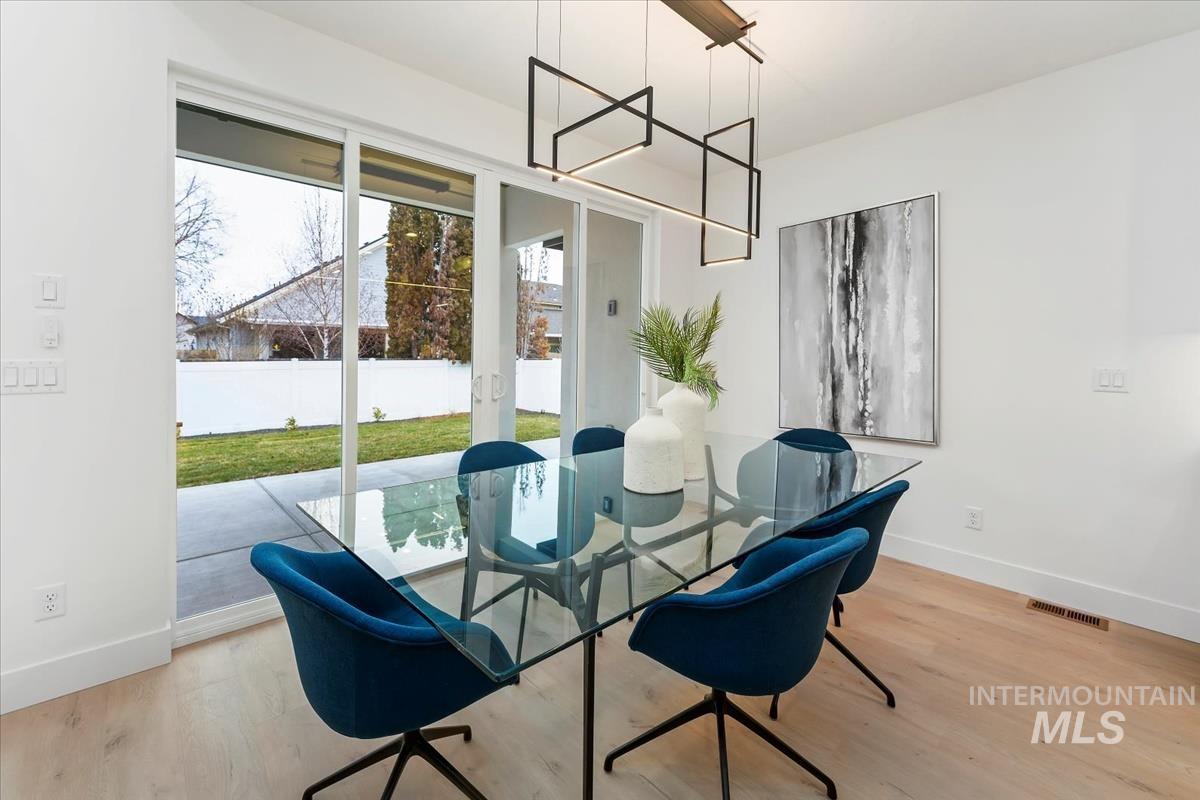 6248 West Elmer Street Boise, ID 83703 - Photo 28 of 40 Dining area featuring baseboards and light wood-style floors