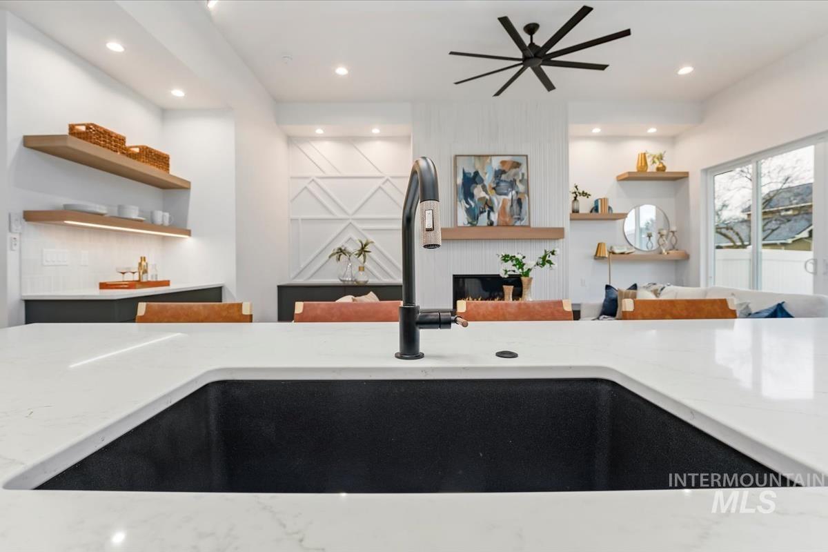 6248 West Elmer Street Boise, ID 83703 - Photo 40 of 40 Kitchen with light stone countertops, open shelves, a ceiling fan, recessed lighting, and open floor plan