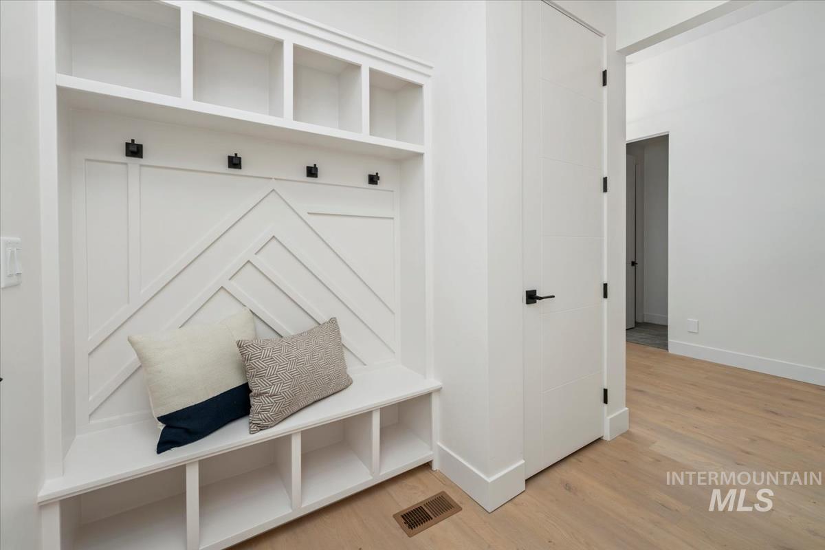 6248 West Elmer Street Boise, ID 83703 - Photo 7 of 40 Mudroom featuring light wood-type flooring and baseboards