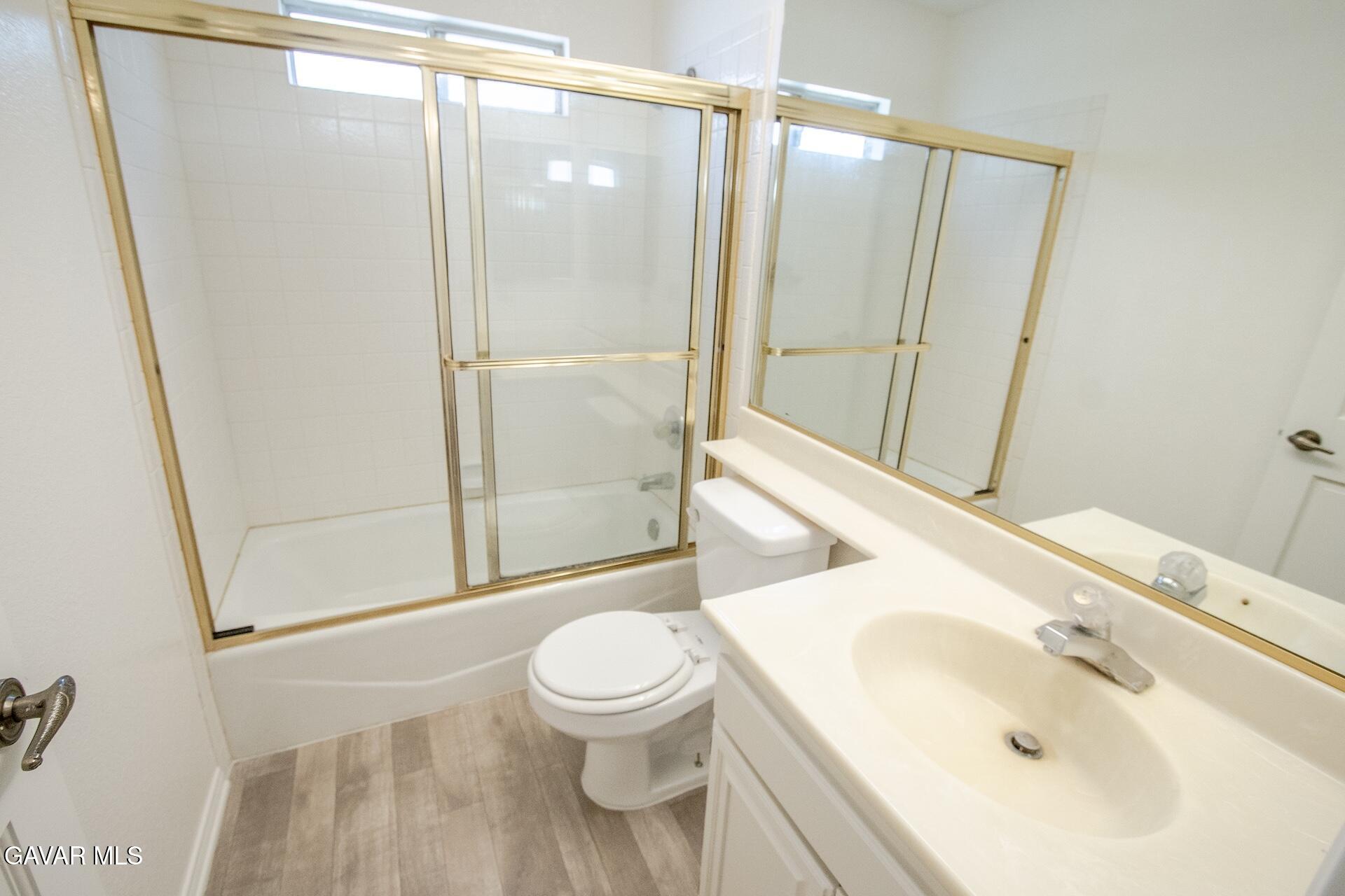 44318 33rd Street West Lancaster, CA 93536 - Photo 24 of 29 a bathroom with a sink and a mirror