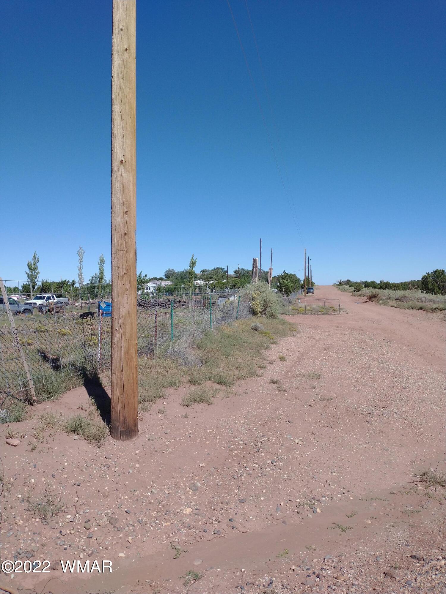 4056 Sorrel Road Snowflake, AZ 85937 - Photo 5 of 16 a view of a dirt road with a building in the background
