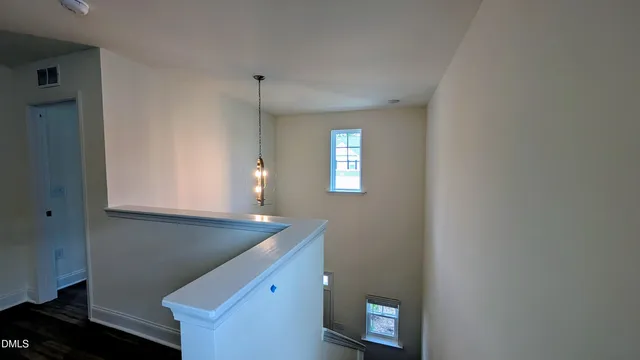 a view of a kitchen cabinets and a window