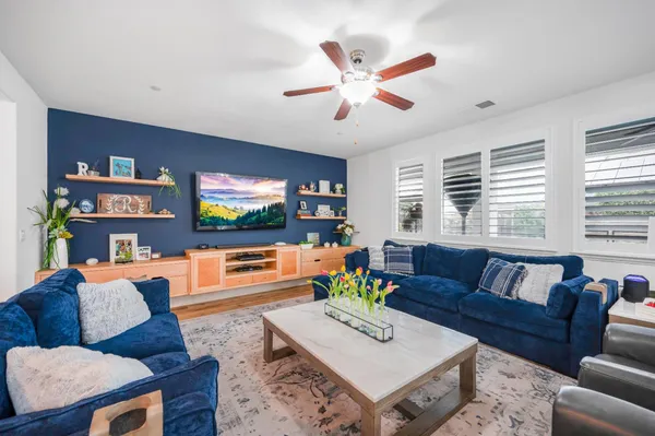 a large kitchen with a table and chairs