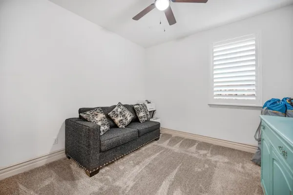 a spacious bathroom with a double vanity sink a mirror and a shower