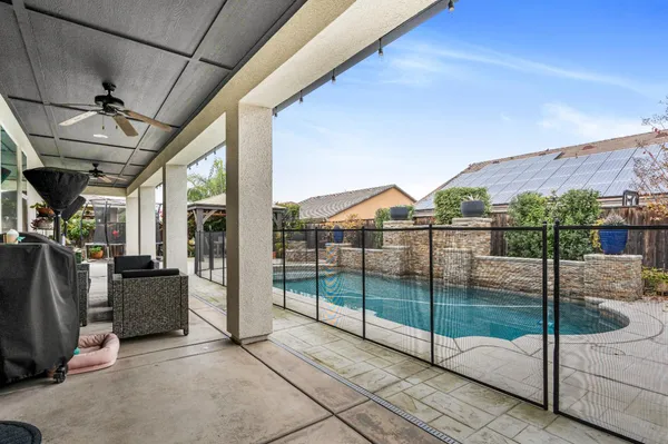 a view of a swimming pool with a patio