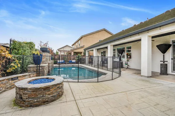 a view of a swimming pool with sitting area
