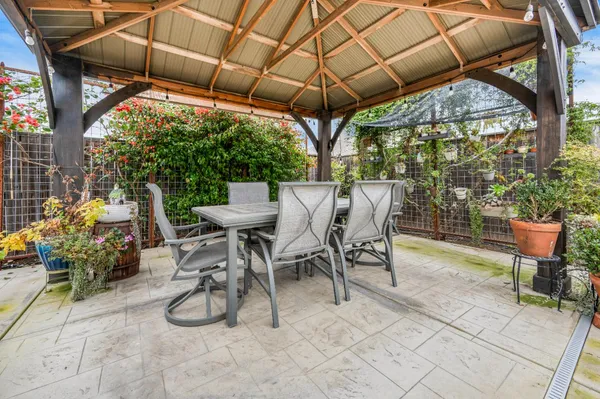 a view of a bunch of flowers in front of house