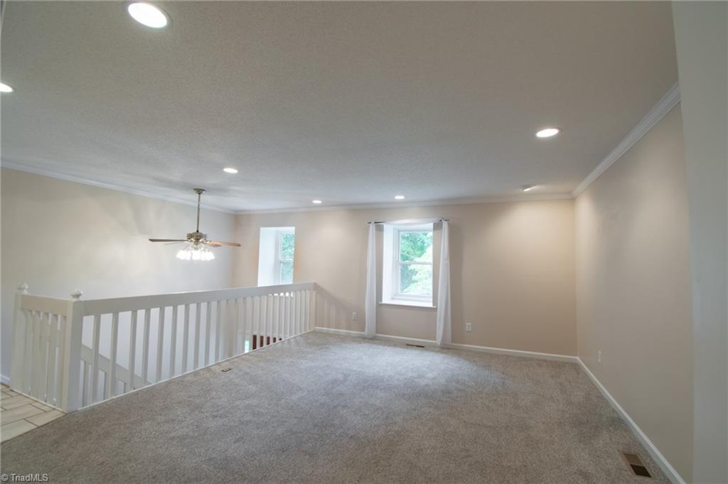 5808 Oakside Road Winston-Salem, NC 27104 - Photo 8 of 29 Living room with like-new carpet. Recessed lights throughout much of the house