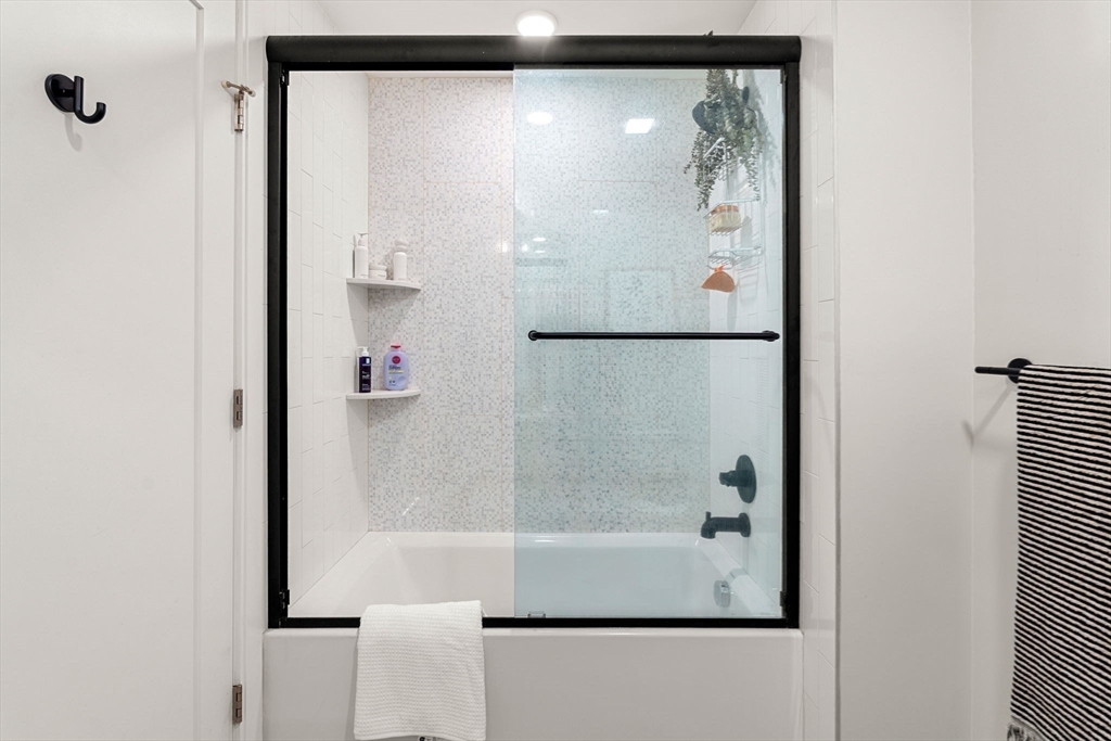287 Maverick Street, Unit 201 Boston, MA 02128 - Photo 13 of 17 a bathroom with a shower