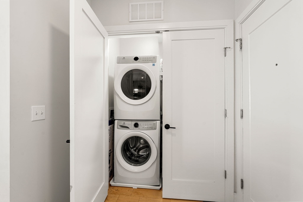 287 Maverick Street, Unit 201 Boston, MA 02128 - Photo 14 of 17 a utility room with dryer and washer