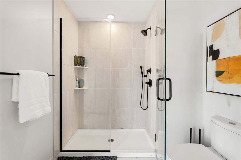 287 Maverick Street, Unit 201 Boston, MA 02128 - Photo 10 of 17 a bathroom with a shower