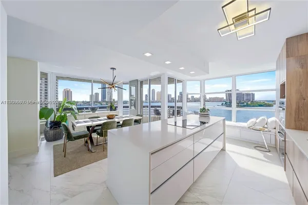 a very nice looking living room with a large window and furniture