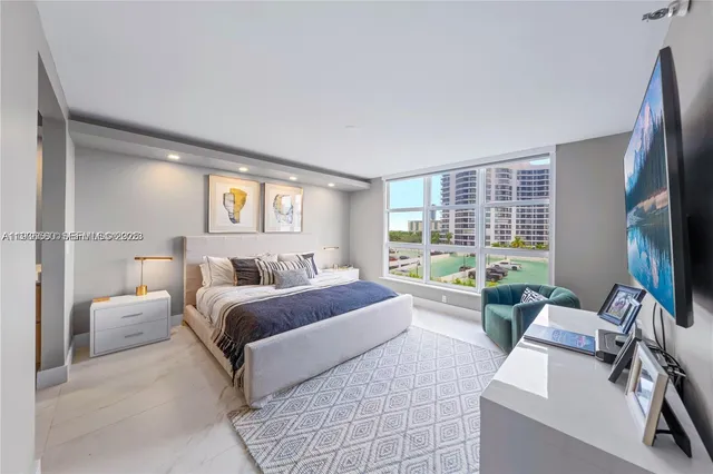 a bedroom with a bed and glass window