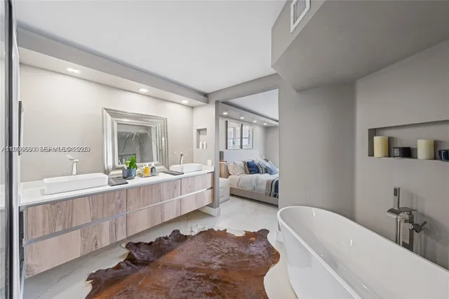 a room with a couch and a view of living room