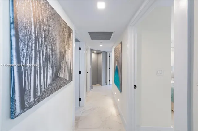 a view of a hallway with wooden shelves