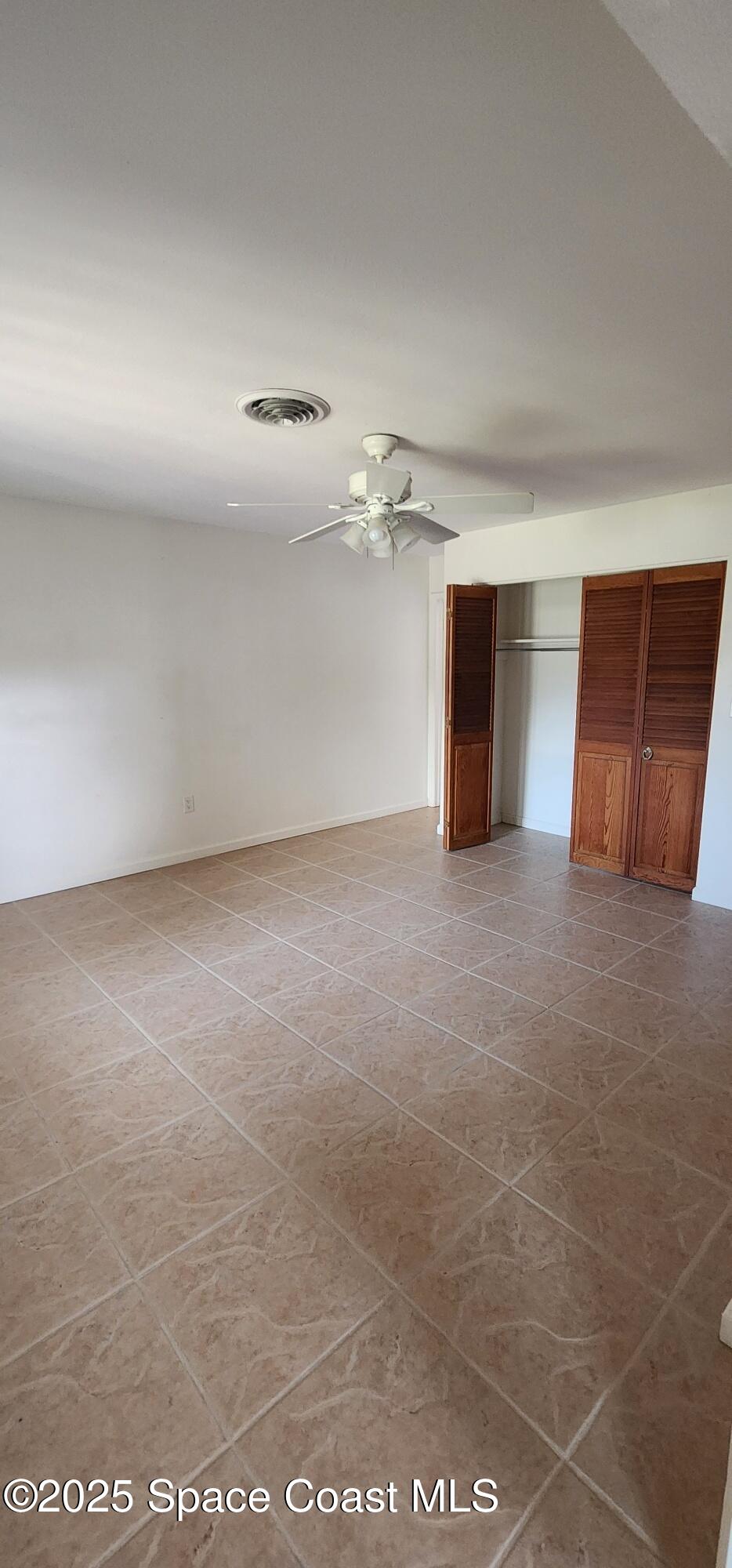 1041 Bali Road Cocoa Beach, FL 32931 - Photo 12 of 23 a view of a room with a furniture