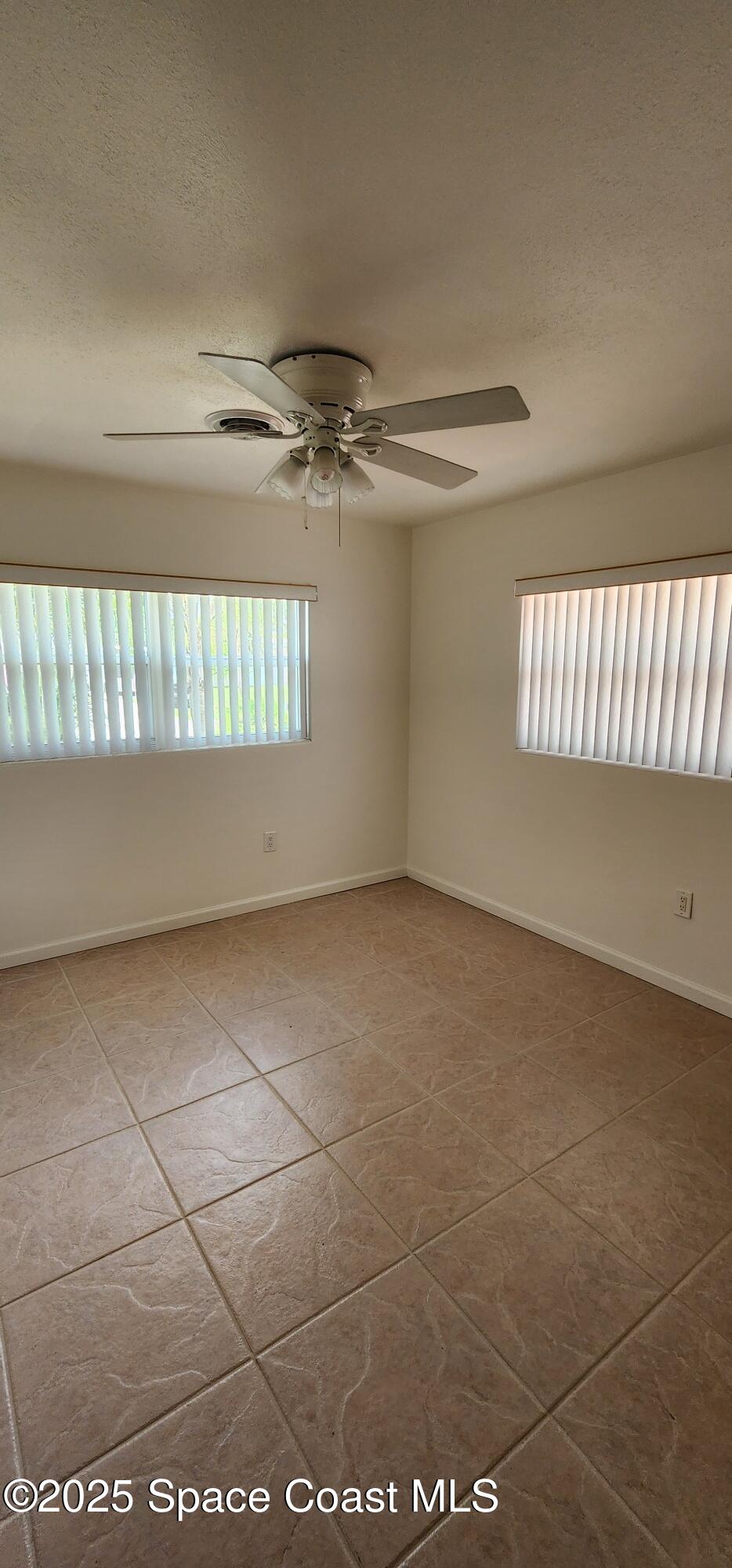 1041 Bali Road Cocoa Beach, FL 32931 - Photo 16 of 23 a view of an empty room and window
