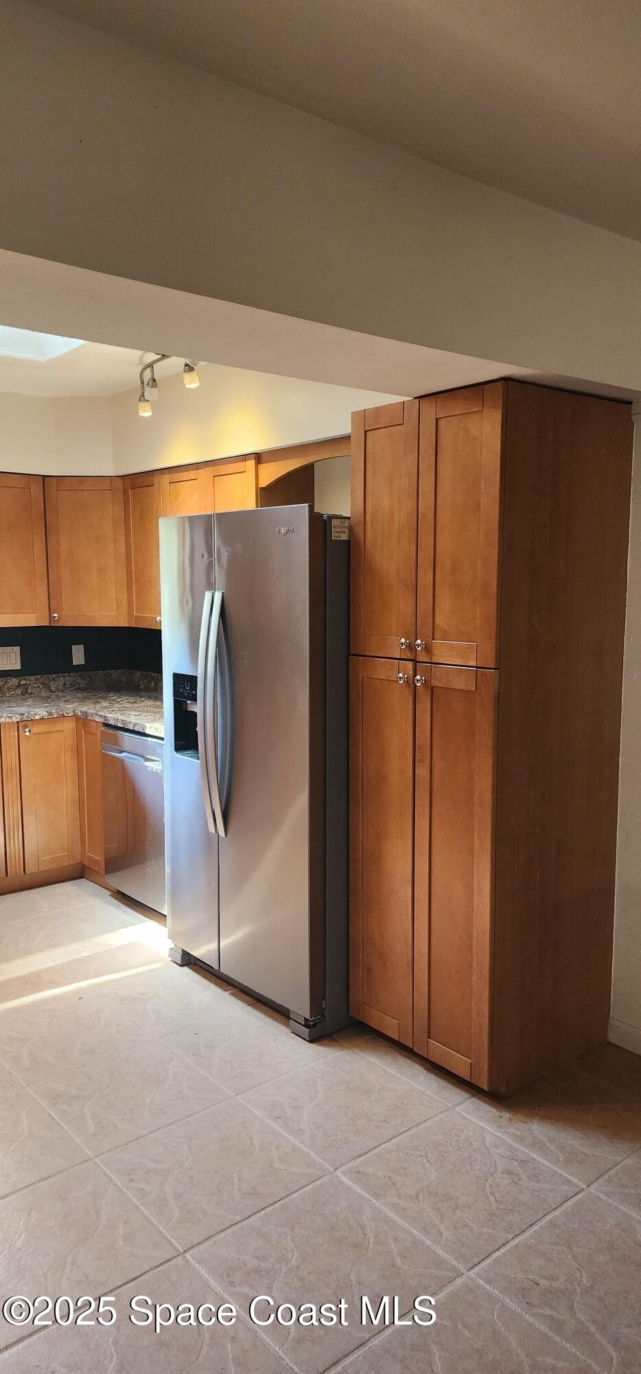 1041 Bali Road Cocoa Beach, FL 32931 - Photo 5 of 23 a view of a refrigerator and window in a room
