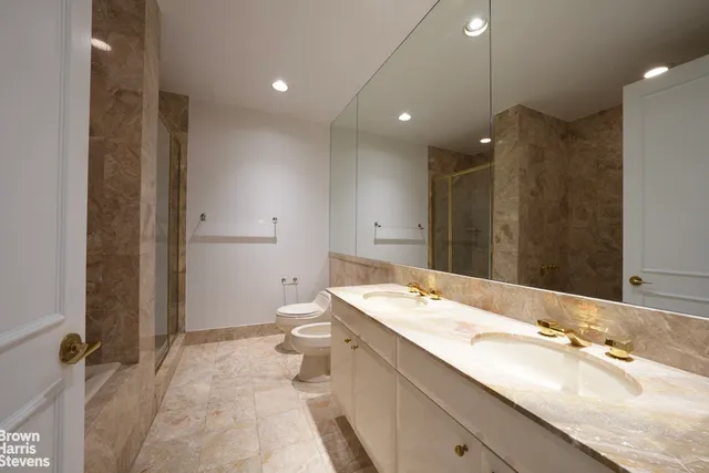 a kitchen with stainless steel appliances granite countertop a sink and a stove