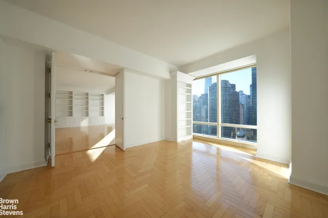 a view of an empty room with glass door