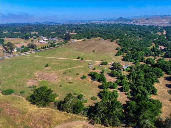 a view of a back yard with green space