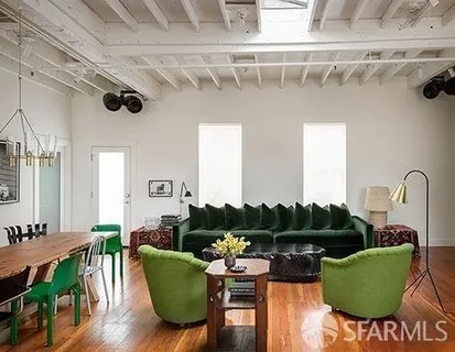 a living room with furniture a rug and a window