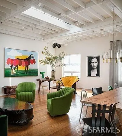 a living room with furniture dining room and wooden floor