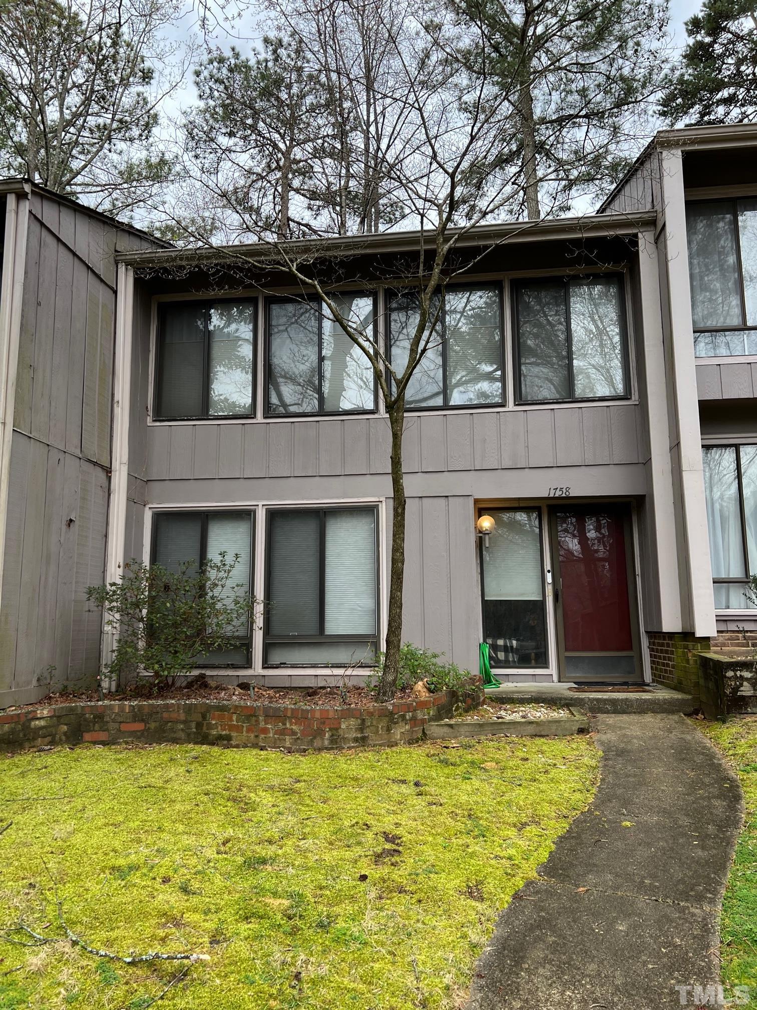 1758 Quail Ridge Road Raleigh, NC 27609 - Photo 6 of 37 a view of a building with a yard