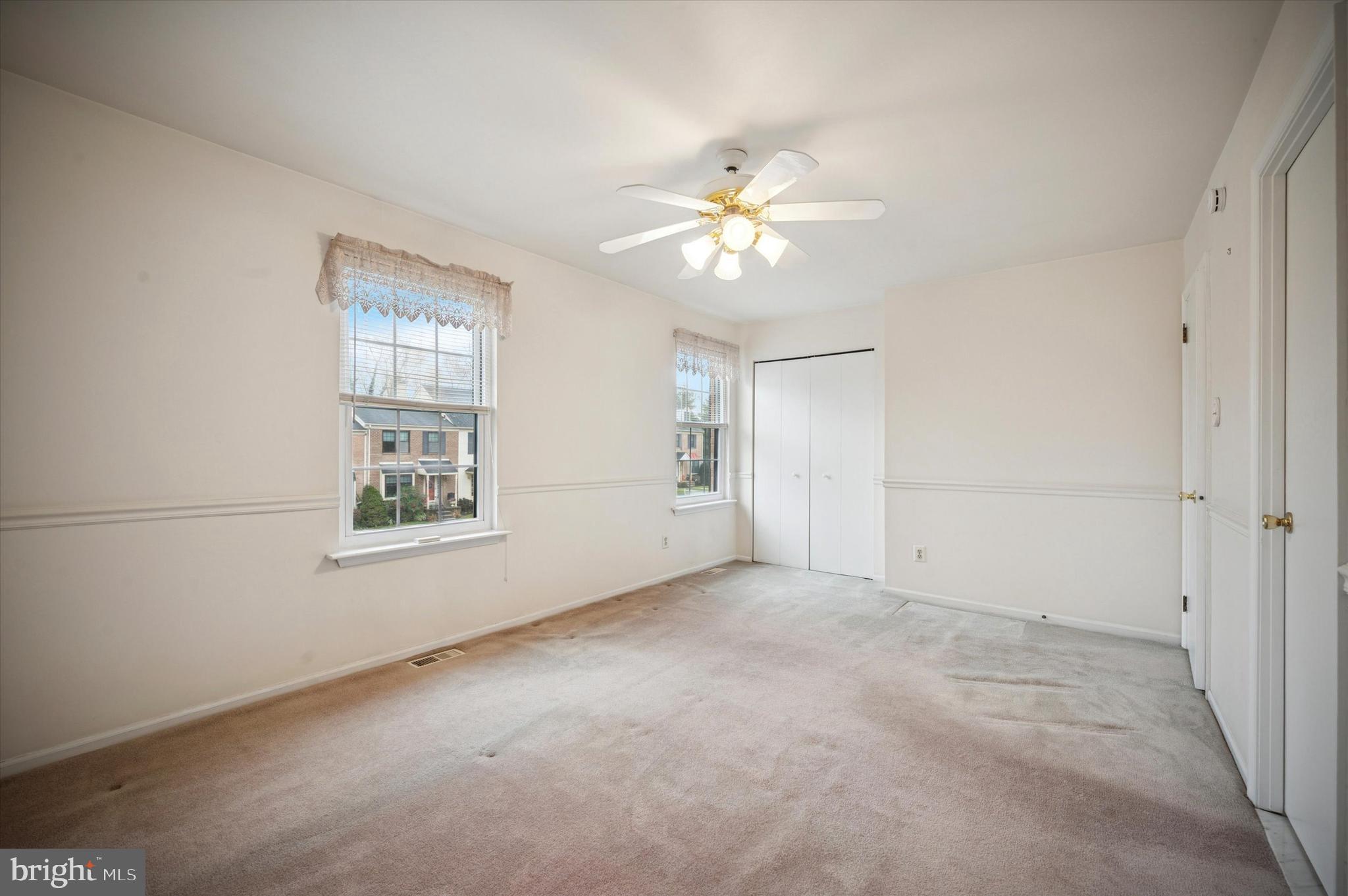 25 Ruth Road Brookhaven, PA 19015 - Photo 11 of 15 an empty room with windows and fan