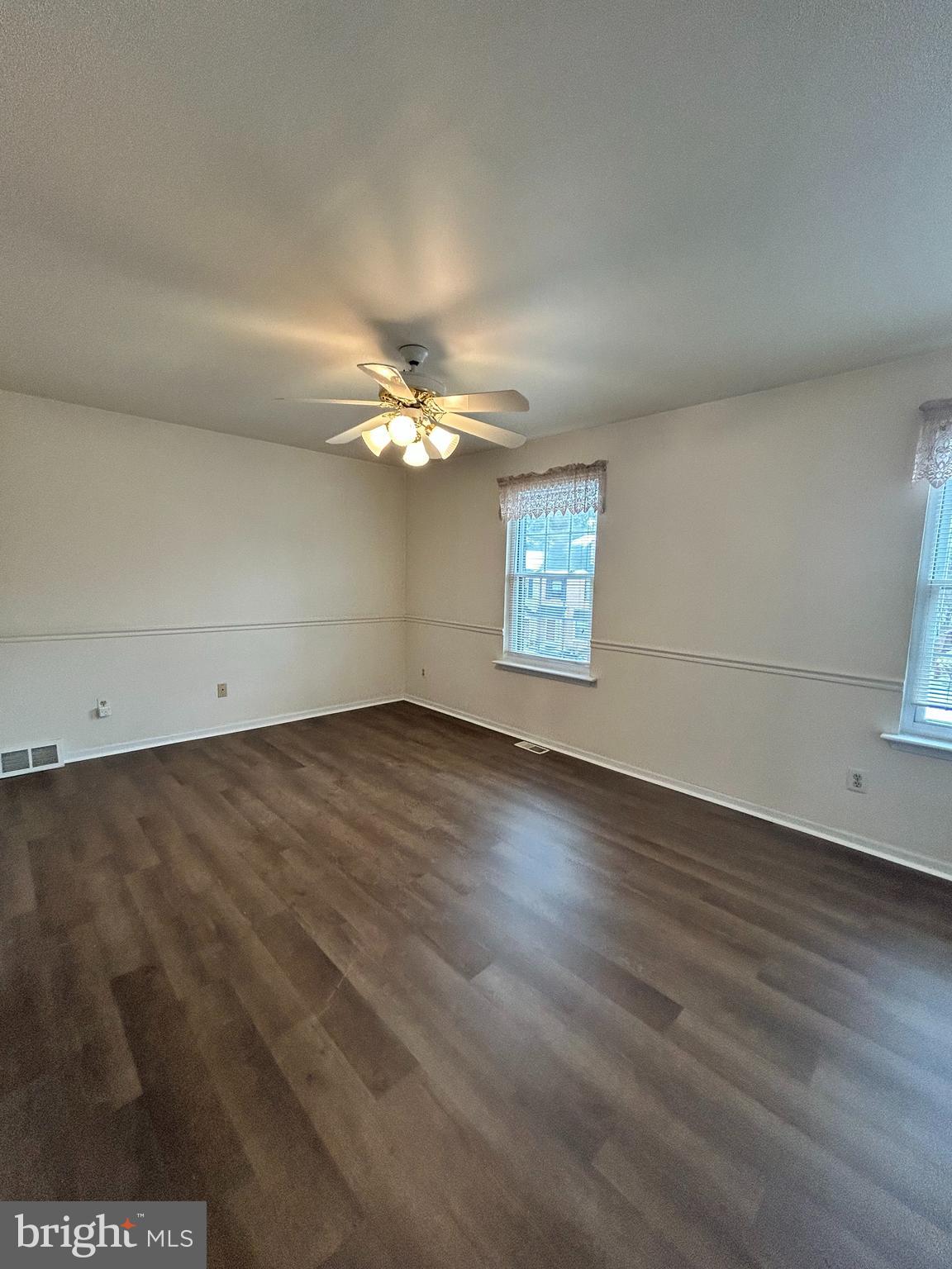 25 Ruth Road Brookhaven, PA 19015 - Photo 14 of 18 an empty room with wooden floor and windows