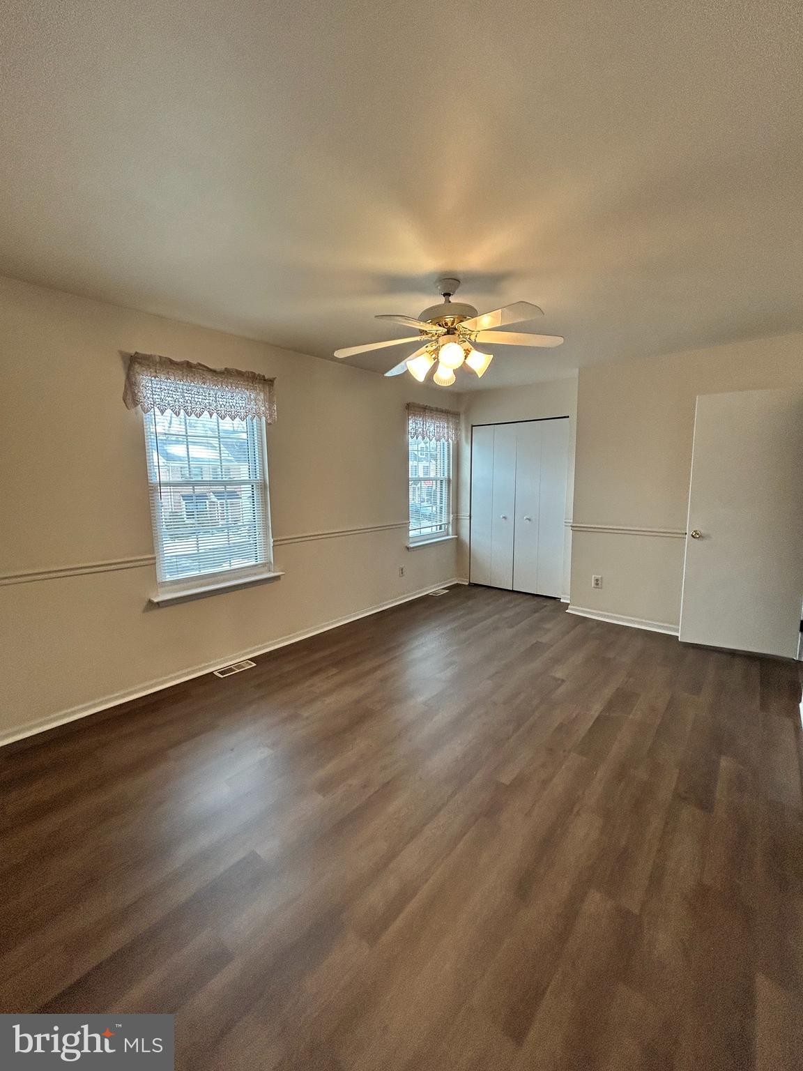 25 Ruth Road Brookhaven, PA 19015 - Photo 15 of 18 an empty room with wooden floor and windows