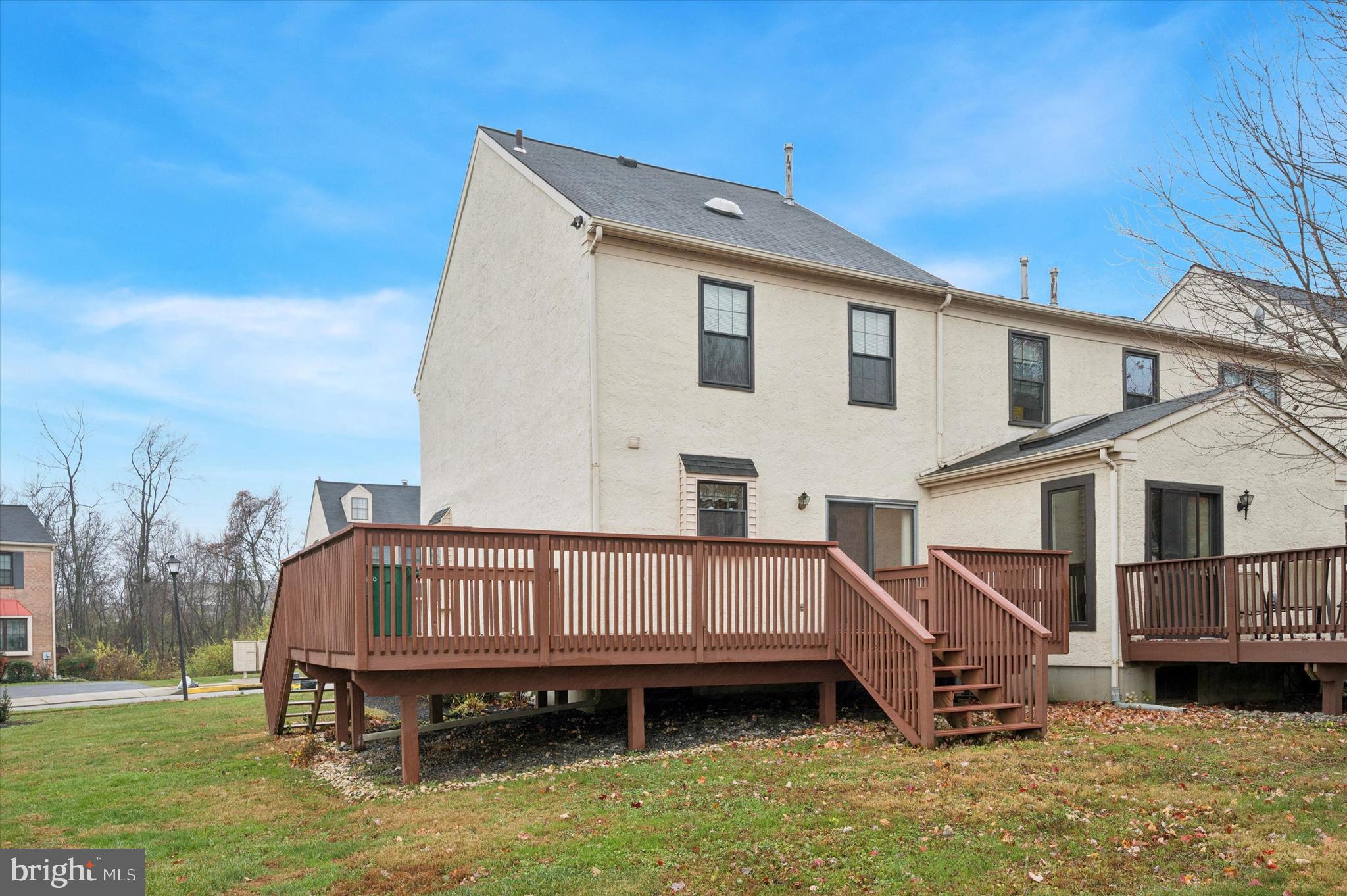 25 Ruth Road Brookhaven, PA 19015 - Photo 15 of 15 a view of a house with a wooden deck and a yard