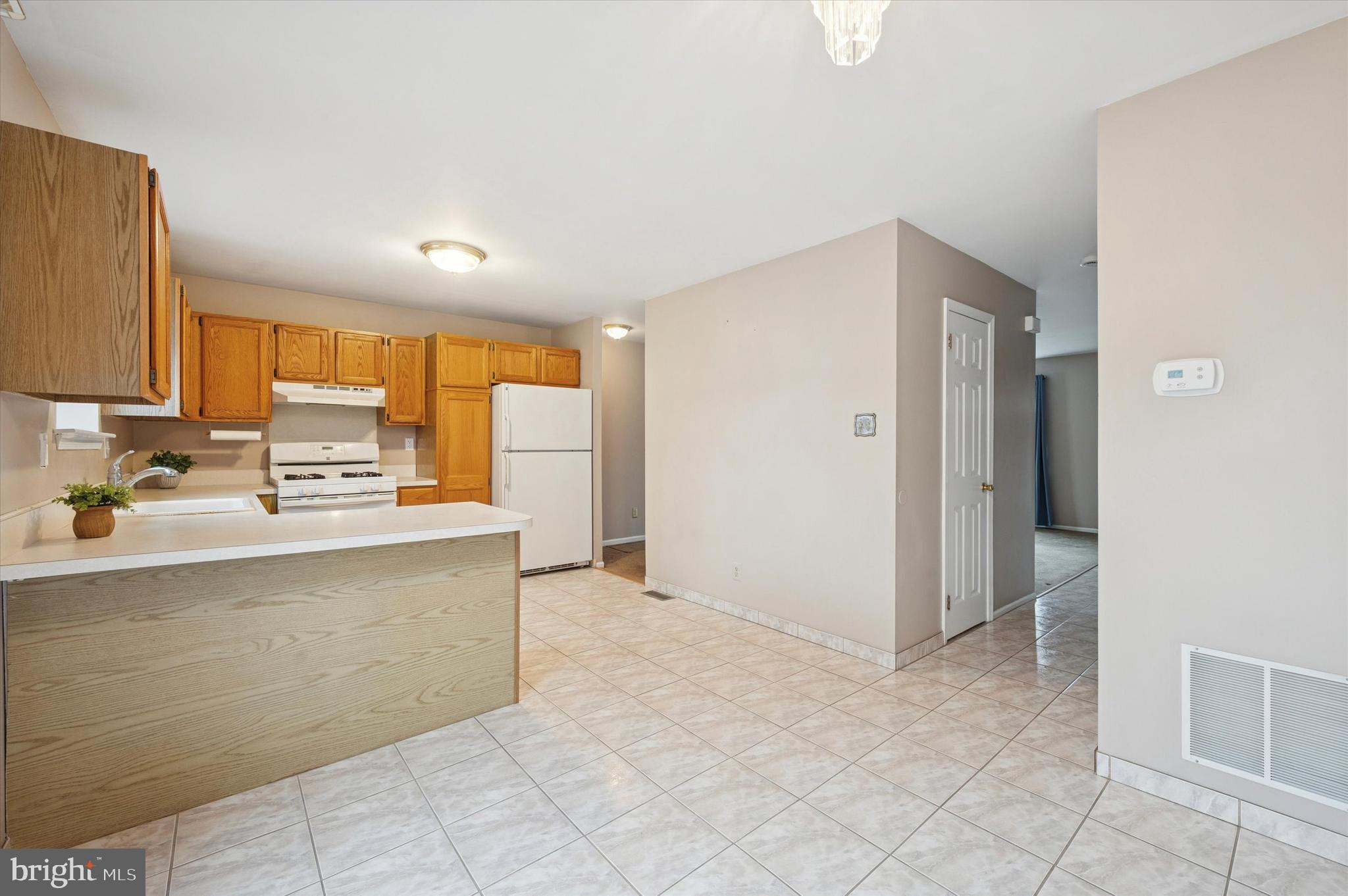 25 Ruth Road Brookhaven, PA 19015 - Photo 9 of 18 a kitchen with stainless steel appliances a sink stove and cabinets