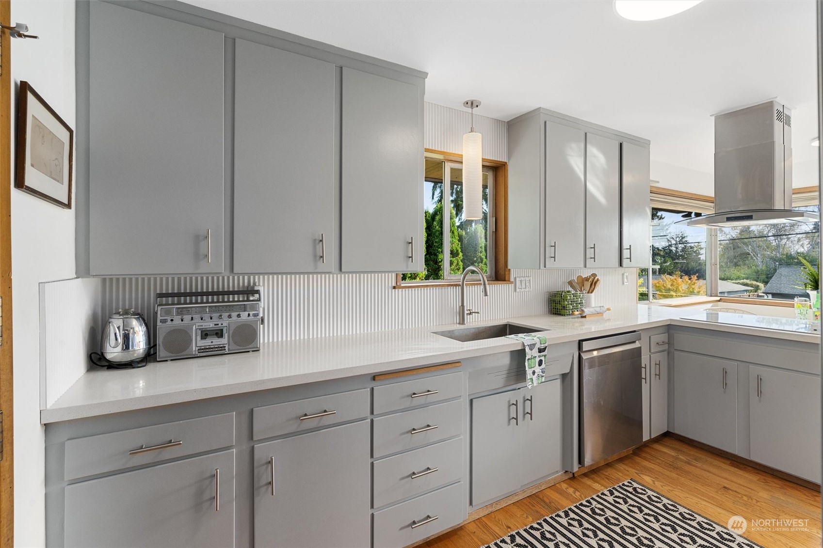 3616 Southwest 112th Street Seattle, WA 98146 - Photo 11 of 40 a kitchen with a sink dishwasher a stove and cabinets