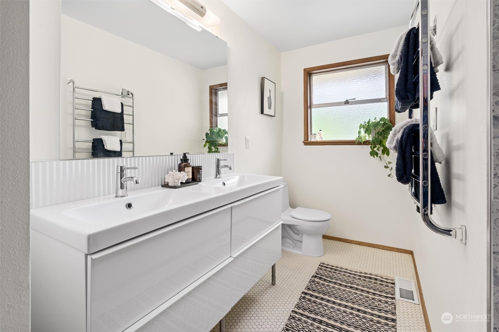 3616 Southwest 112th Street Seattle, WA 98146 - Photo 16 of 40 a bathroom with a sink a toilet and a mirror