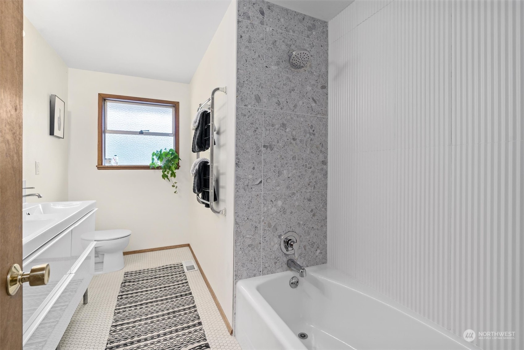 3616 Southwest 112th Street Seattle, WA 98146 - Photo 17 of 40 a bathroom with a sink a toilet and shower