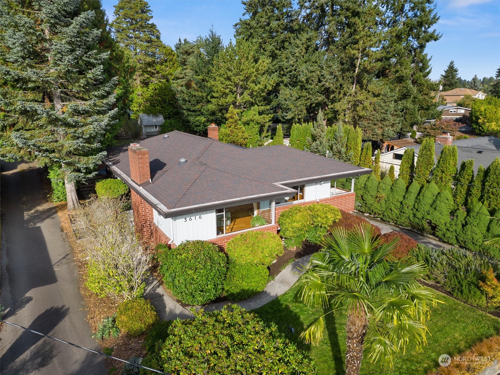 3616 Southwest 112th Street Seattle, WA 98146 - Photo 2 of 40 an aerial view of a house with yard and outdoor seating