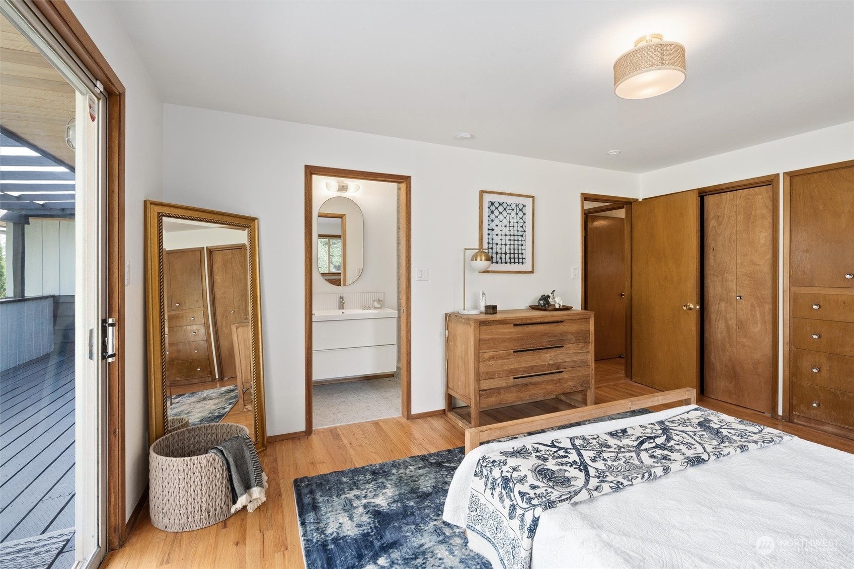 3616 Southwest 112th Street Seattle, WA 98146 - Photo 22 of 40 a bedroom with a bed and wooden floor