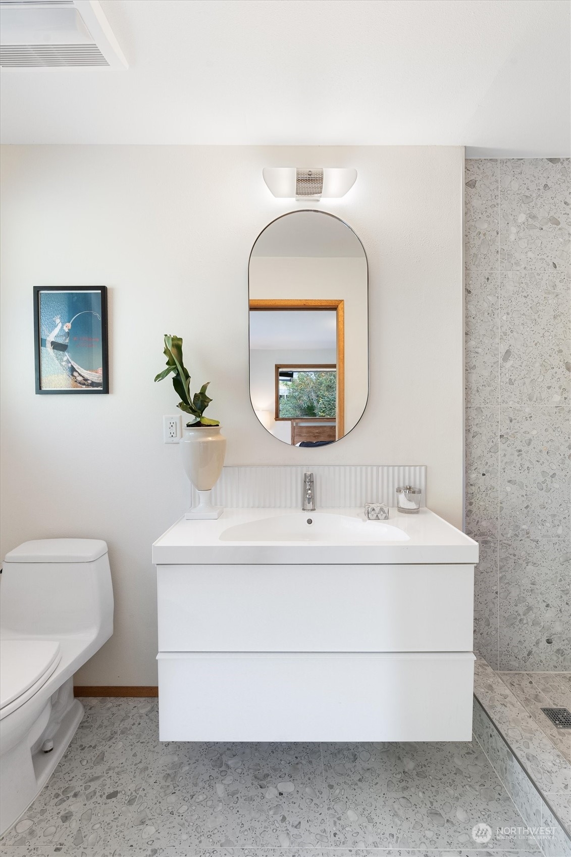 3616 Southwest 112th Street Seattle, WA 98146 - Photo 23 of 40 a bathroom with a toilet a sink and mirror
