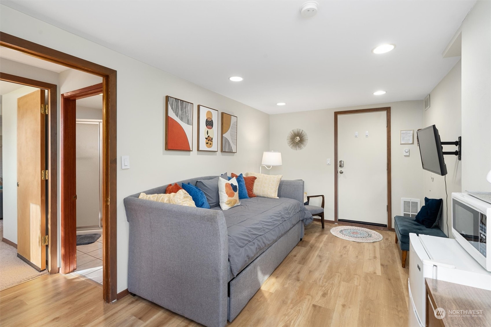 3616 Southwest 112th Street Seattle, WA 98146 - Photo 31 of 40 a living room with furniture and a flat screen tv