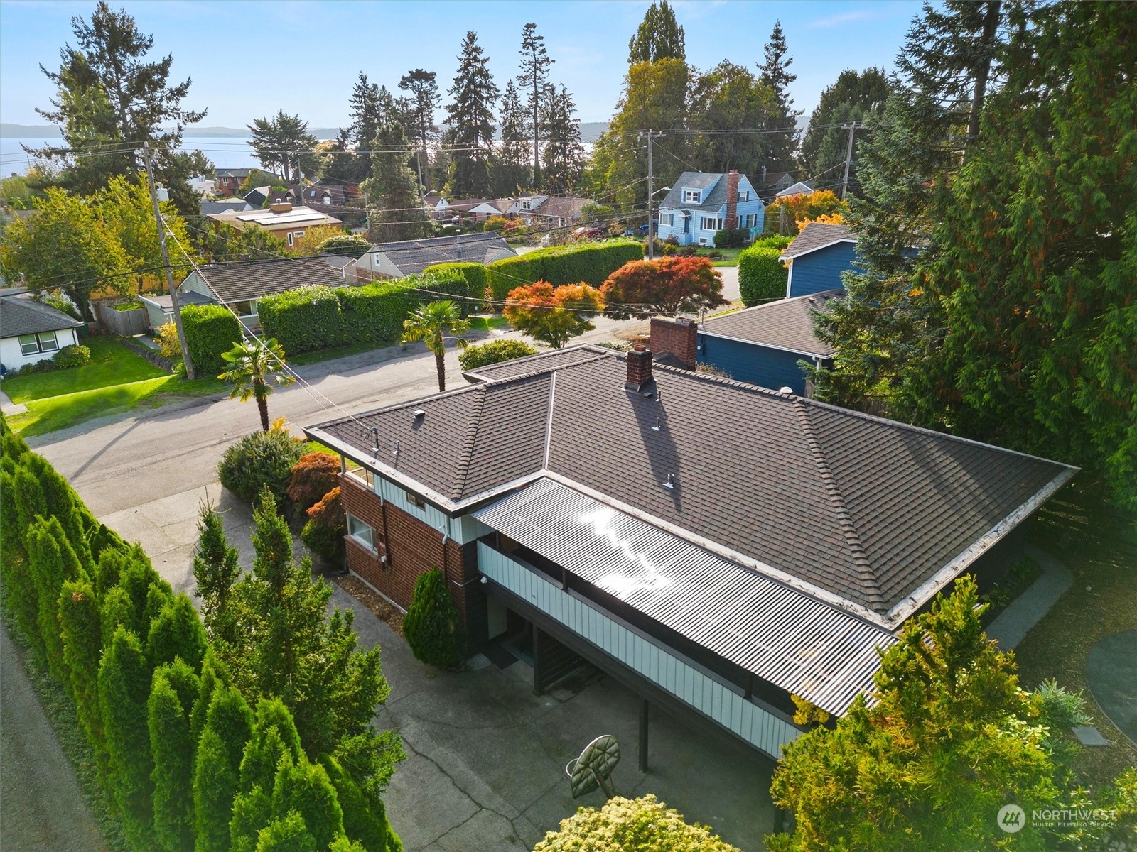 3616 Southwest 112th Street Seattle, WA 98146 - Photo 38 of 40 a view of a swimming pool with a patio and a garden