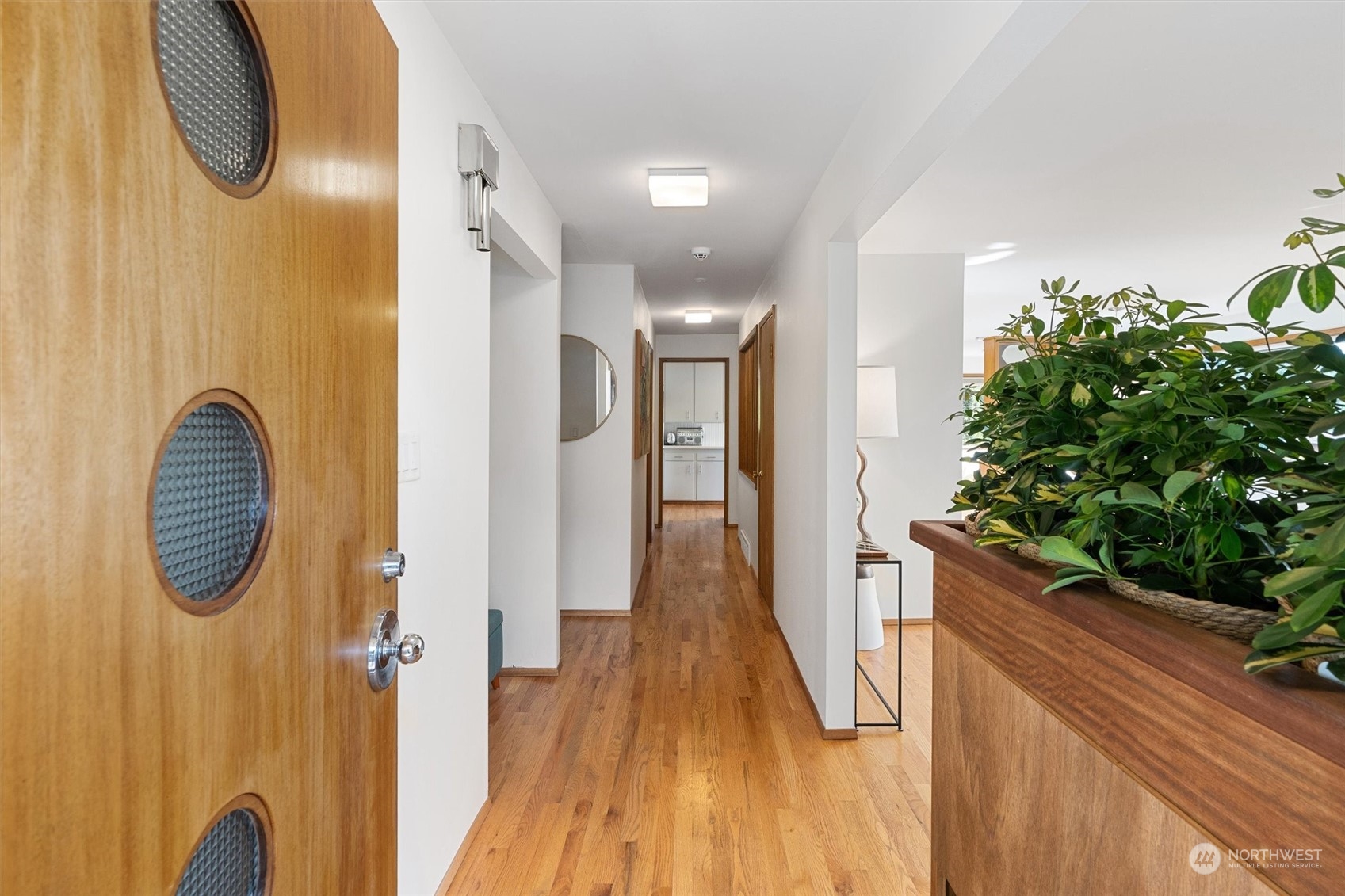 3616 Southwest 112th Street Seattle, WA 98146 - Photo 4 of 40 a view of a hallway with wooden floor