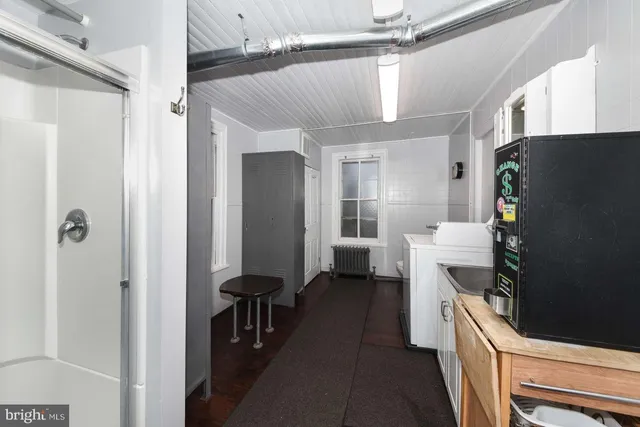a kitchen with a refrigerator and a stove