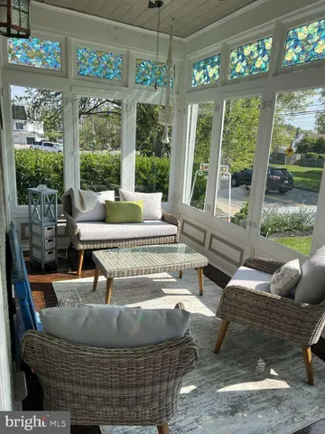 a living room with furniture and garden view