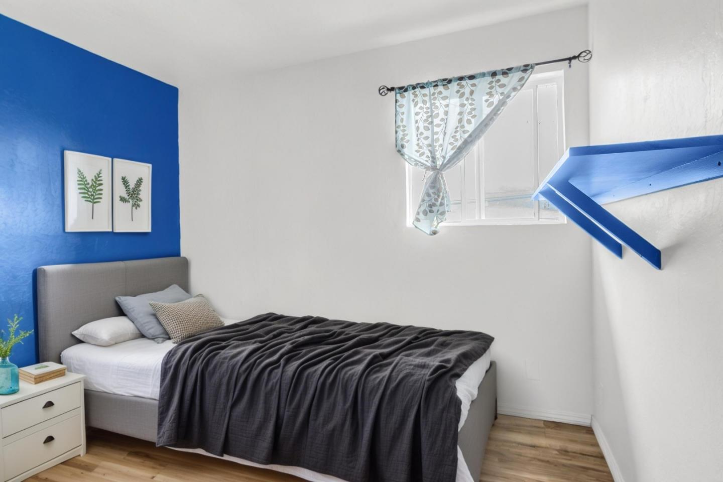 25540 Payson Street Chualar, CA 93925 - Photo 11 of 31 a bedroom with a bed and wooden floor