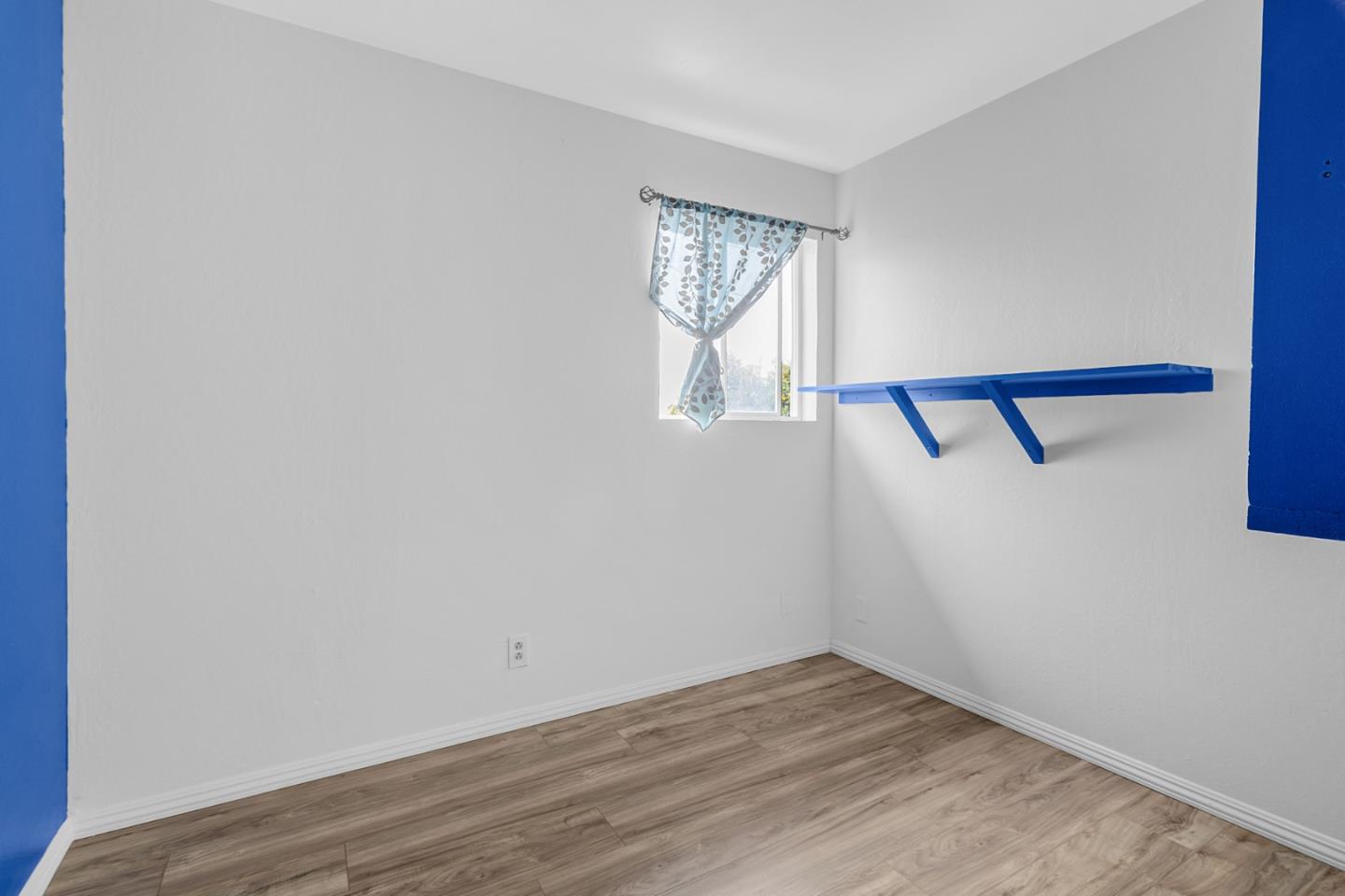 25540 Payson Street Chualar, CA 93925 - Photo 12 of 31 a view of an empty room with wooden floor and a window