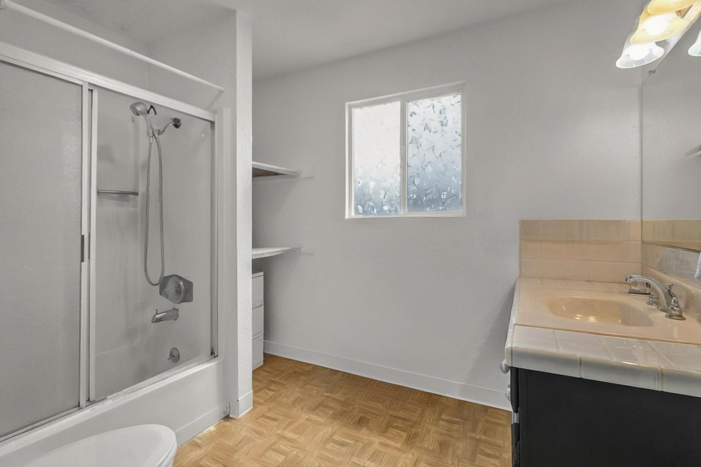 25540 Payson Street Chualar, CA 93925 - Photo 14 of 31 a bathroom with a shower sink and mirror