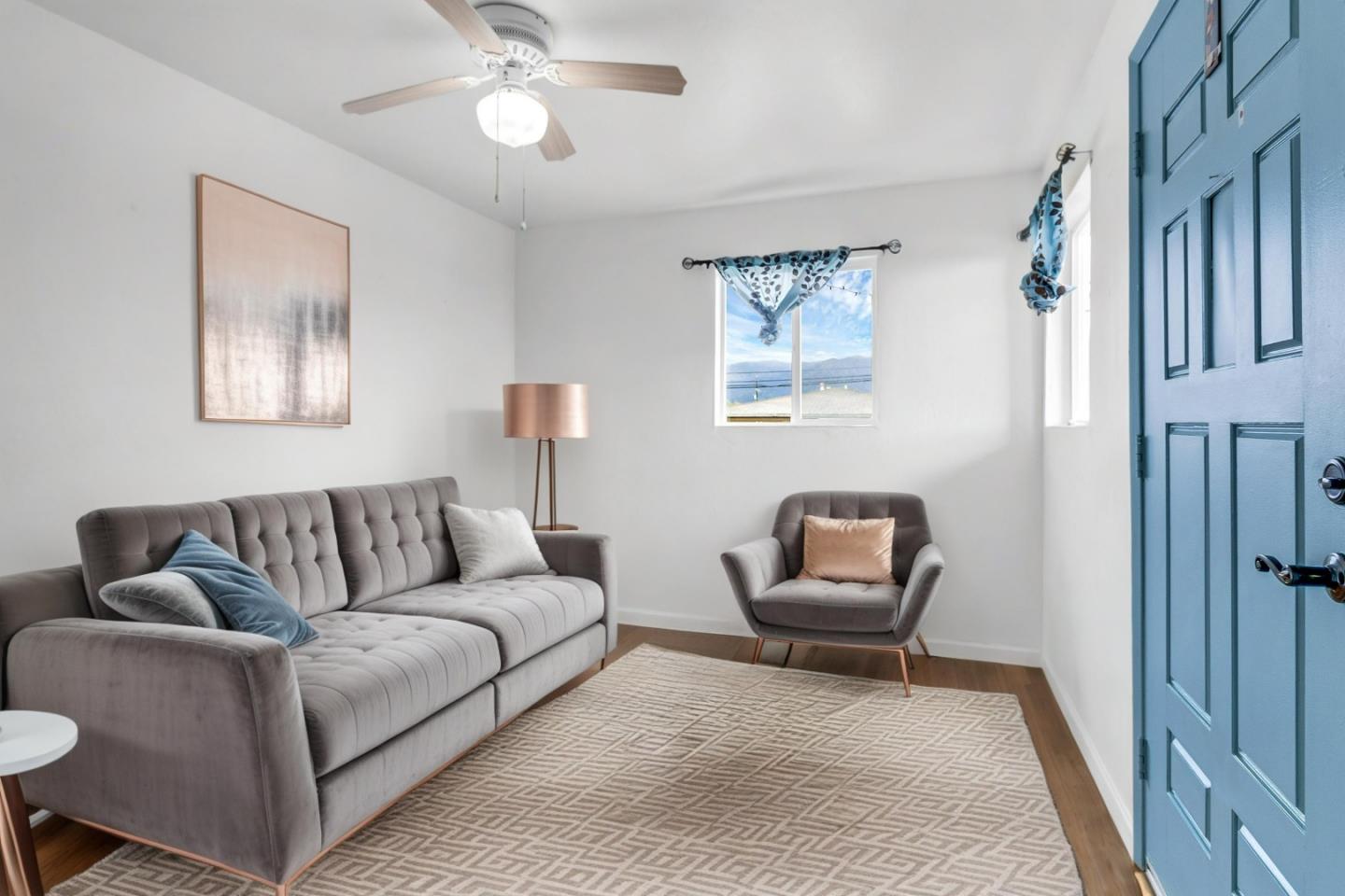 25540 Payson Street Chualar, CA 93925 - Photo 7 of 31 a living room with furniture and a lamp