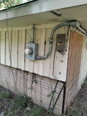 a view of a wooden house with a yard